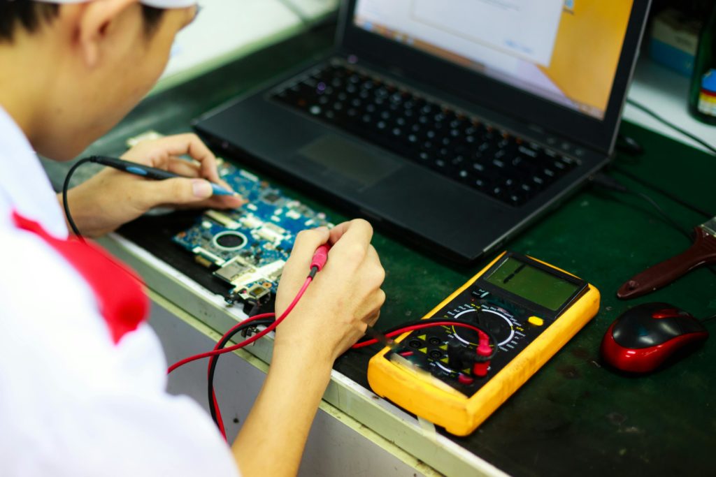 maintenance technician testing alarm modern interior aesthetic professional photography