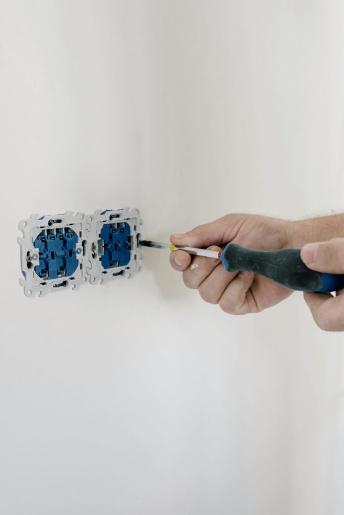 electrician installing outlet modern interior aesthetic professional photography.jpg